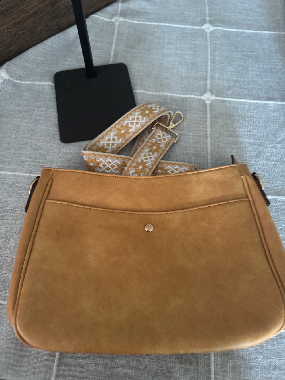 Versatile Tan Crossbody Bag with Decorative Woven Strap